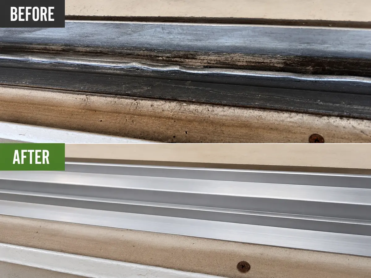 Clean sliding door track with a hidden damaged roller.